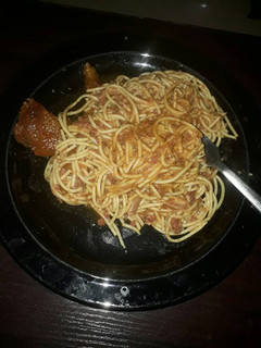 A picture of Jollof spaghetti and chicken.