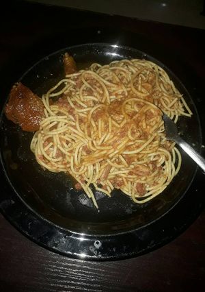 A picture of Jollof spaghetti and chicken.