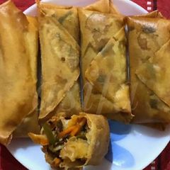 A picture of Schezwan Chicken spring roll.