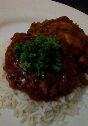 A picture of Chicken in tomato gravy.