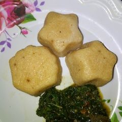A picture of Moimoi with spinach sauce.
