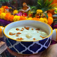 A picture of Khira gaintha (Rice flour balls in flavoured thick milk mixture).