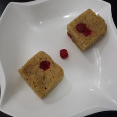 A picture of Vanilla cake with cherries.