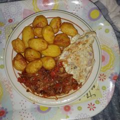A picture of Potato with fried egg.
