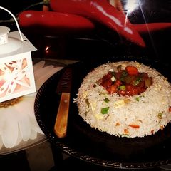 A picture of Chilli Chicken with Fried rice.