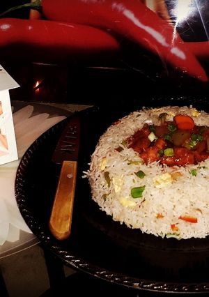 A picture of Chilli Chicken with Fried rice.