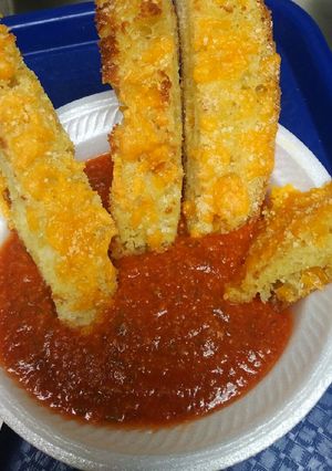 A picture of Ciabatta Bread Sticks and Sauce.