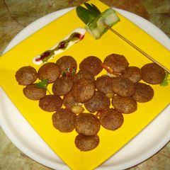 A picture of Kooto atta - button idli pakora.