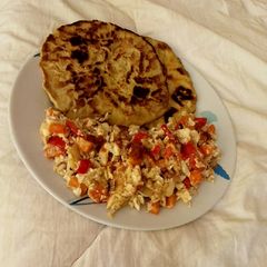 A picture of Buttered Paratha with scrambled egg.