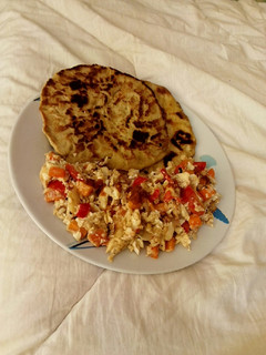 A picture of Buttered Paratha with scrambled egg.