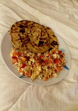 A picture of Buttered Paratha with scrambled egg.