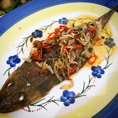 A picture of Whole baked fish with fragrant chilli onion oil.