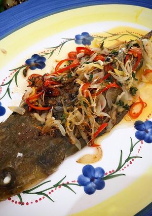 A picture of Whole baked fish with fragrant chilli onion oil.