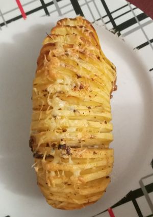 Una foto de Papas en láminas al horno