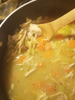 A picture of Chicken soup (with bones).