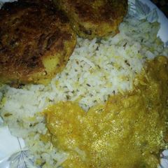 A picture of Daal chawal with cutlus.