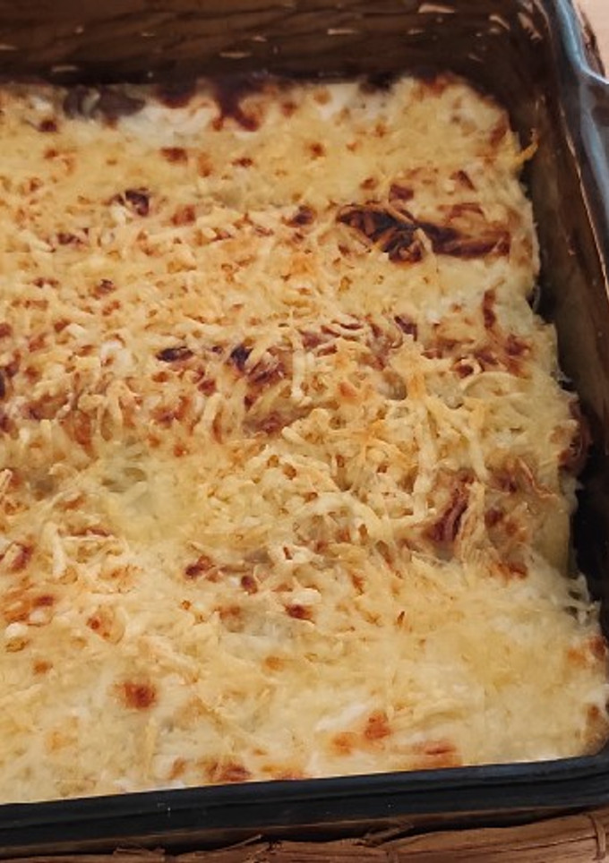 Una foto de Lasaña de gulas y champiñones