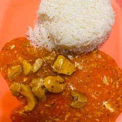 A picture of Plain rice with chicken Manchurian.