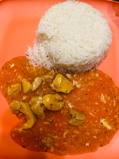A picture of Plain rice with chicken Manchurian.