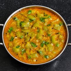 A picture of Snake gourd curry.