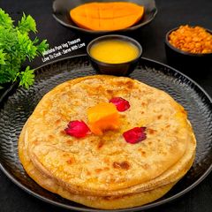 A picture of Aamba Puran Poli - Alphonso Mango Puran Poli - Gujarati Festive Treat.