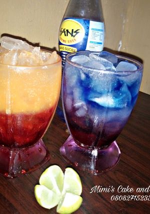 A picture of Sunrise moctail and layered blue paradise.