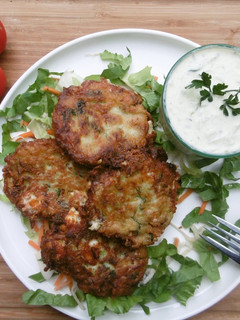 A picture of Courgette Patties with Tzaziki Dip.