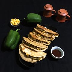 A picture of Capsicum Corn stuffed Wheat Flour Tacos.