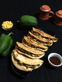 A picture of Capsicum Corn stuffed Wheat Flour Tacos.