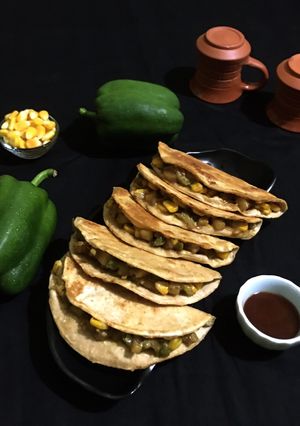 A picture of Capsicum Corn stuffed Wheat Flour Tacos.