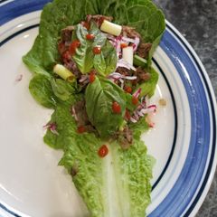 A picture of Pho-flavor flank steak lettuce wraps.