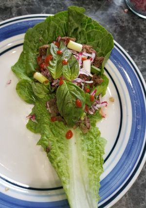 A picture of Pho-flavor flank steak lettuce wraps.