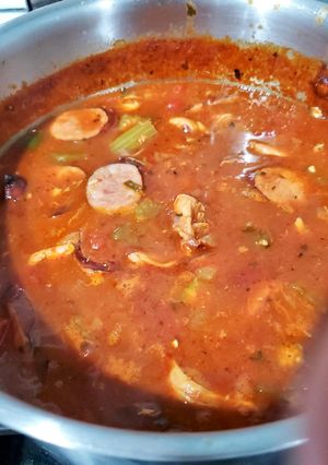 A picture of Smoked Duck, Crawfish, and Andouille Pork Sausage Cajun Gumbo (Surf, Turf, and Sky).