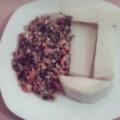 A picture of Boiled Yam and vegetable egg sauce.