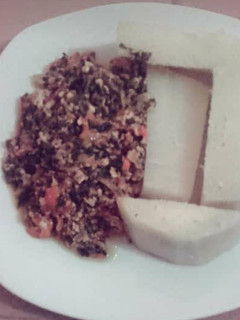 A picture of Boiled Yam and vegetable egg sauce.