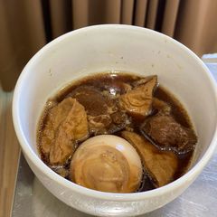 Egg and pork in sweet brown soup A picture of Egg and pork in sweet brown soup.