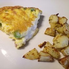 A picture of Scamorza, pancetta and asparagus frittata, with crispy potatoes.