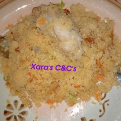 A picture of Veggies Couscous with Chicken.