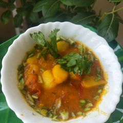 A picture of Twisted Aloo-Tamatar Curry.