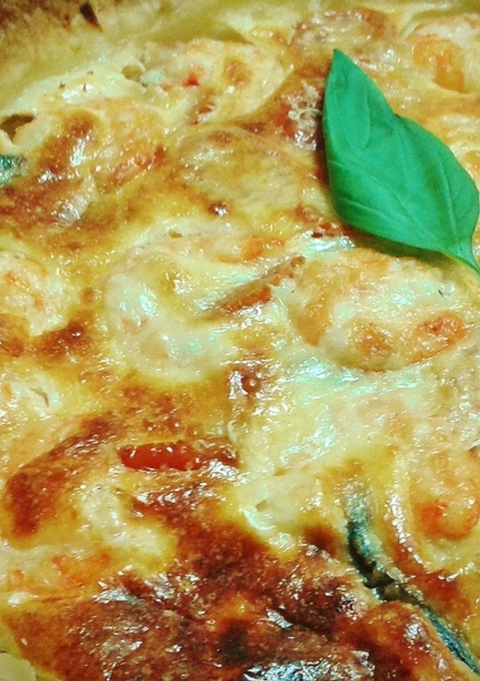 Una foto de Berenjena a la parmesana con langostinos