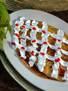 A picture of Pancake with whipped cream.