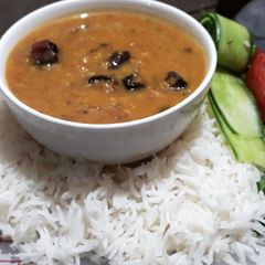 Khatti dal and white plain rice A picture of Khatti dal and white plain rice.