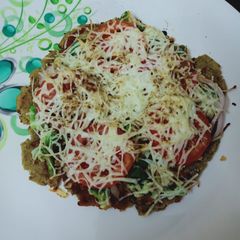 A picture of Palak paneer parathapizza.
