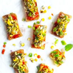 A picture of Pizza toast with grilled corn salsa.
