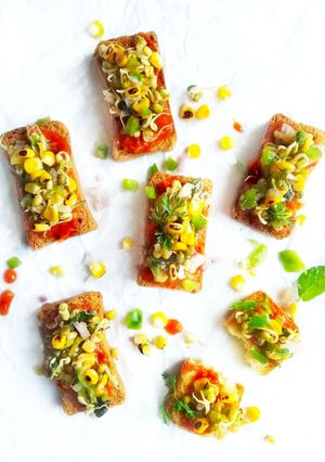 A picture of Pizza toast with grilled corn salsa.