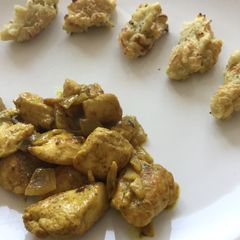 A picture of Chicken curry & ginger with mashed potato and zucchini baked tater.