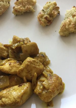 A picture of Chicken curry & ginger with mashed potato and zucchini baked tater.