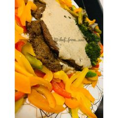 A picture of Butter Beef Steaks serve with pepper white sauce and stir fry veggies.