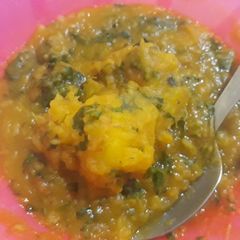 A picture of Sweet potatoes porriage with scent leaves.