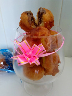 Una foto de Buñuelos de coco rallado rellenos de chocolate al gusto